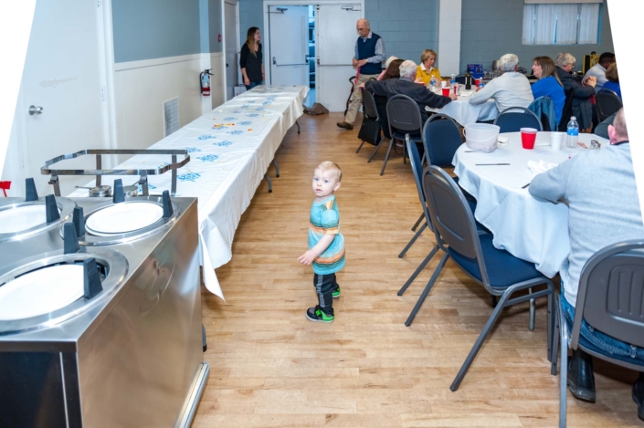 A picture of a young child and his mother at the Ladies Night 2019 dinner.