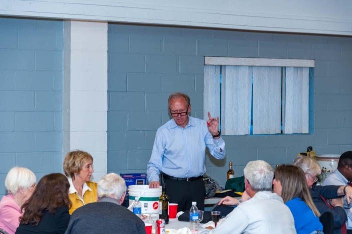 A picture of one of the organizers of the Ladies Night 2019 dinner make an announcement.