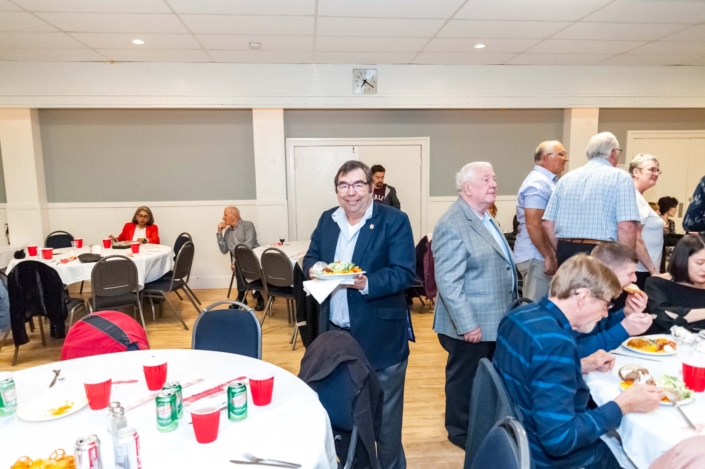 A photo of a guest with his food ready to eat at the ladies night dinner 2019.